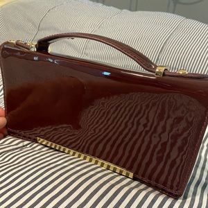 The Limited patent leather burgundy clutch